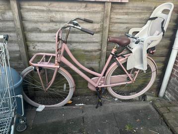 Dames fiets met kinderzitje beschikbaar voor biedingen