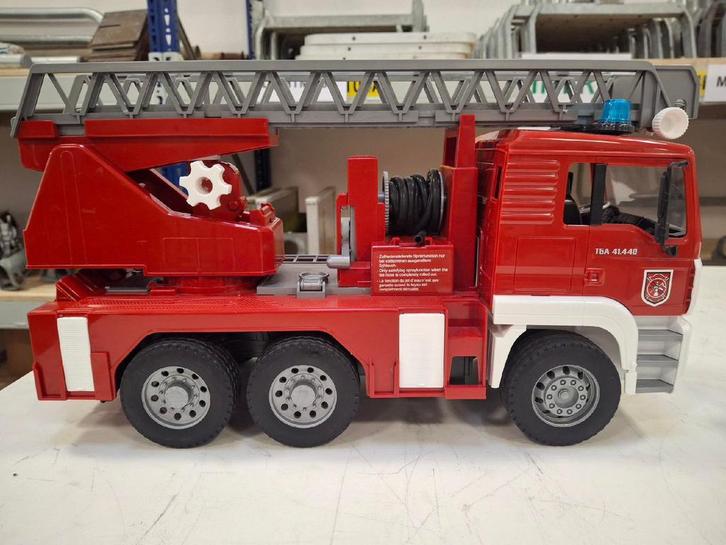 Bruder MAN TGA in brandweer uitvoering, Kinderen en Baby's, Speelgoed | Speelgoedvoertuigen, Zo goed als nieuw, Ophalen of Verzenden