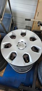 Te koop : Set stalen 16inch velgen met wieldoppen Opel Astra, 205 mm, Velg(en), 16 inch, Gebruikt