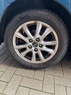 Set Bridgestone winterbanden met originele Mazda velgen, Ophalen, Gebruikt, 16 inch, Banden en Velgen