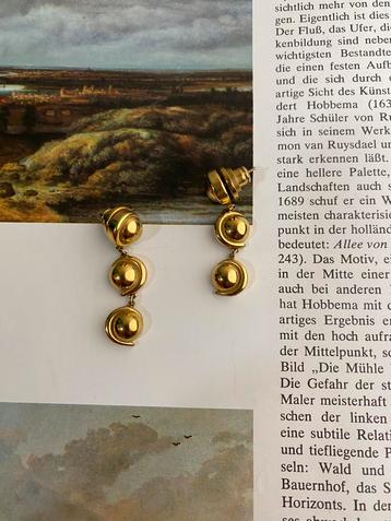 Gouden oorbellen  beschikbaar voor biedingen