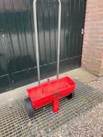 kunstmeststrooier, Ophalen