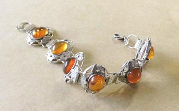 Zilveren schakelarmband met barnsteen   beschikbaar voor biedingen