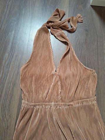 Gave jumpsuit maat S beschikbaar voor biedingen