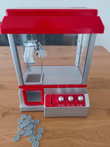 Kauwgumballen/snoep automaat met grijparm beschikbaar voor biedingen
