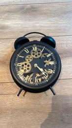 Klok met tandwielen, Ophalen