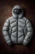 C.P. Company x Palace Goggle Down Jacket – Grey, Ophalen of Verzenden, Zo goed als nieuw, Maat 52/54 (L), Grijs