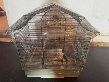 Vogelkooitje met accessoires beschikbaar voor biedingen