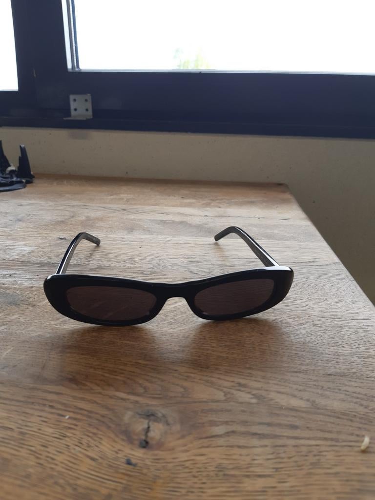 Saint Laurent SL557 SHADE 001, Overige merken, Zonnebril, Zwart, Ophalen of Verzenden