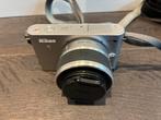 Nikon J1 Model 1 Nikkor met lens 10-30mm, Ophalen of Verzenden, Zo goed als nieuw, Nikon