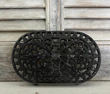 Gietijzeren onderzetter donkergrijs langwerpige onderzetter beschikbaar voor biedingen