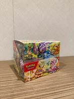 Prismatic Evolutions mini tin sealed Display Case Pokémon, Ophalen of Verzenden, Nieuw, Overige typen