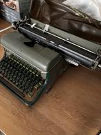 Typemachine van Siemag met hoes, Ophalen