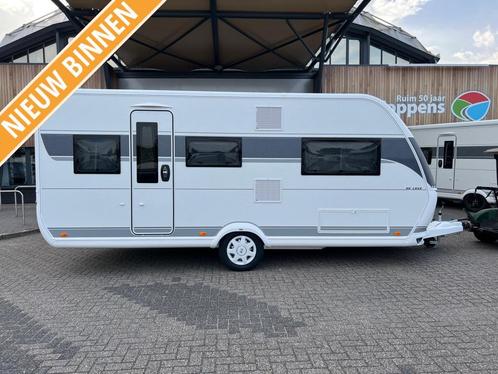 NIEUW BINNEN Hobby 495 UL De Luxe 2024, Caravans en Kamperen, Caravans, Bedrijf, tot en met 4, 1000 - 1250 kg, Standaardzit, Hobby