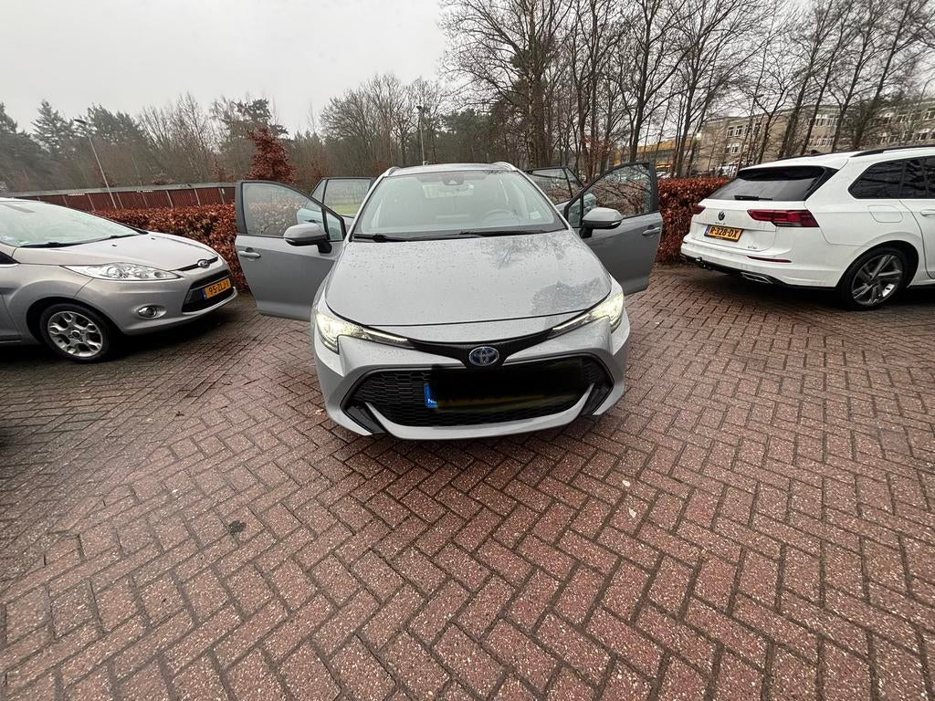 Toyota Corolla TS 1.8 Hybrid 122pk CVT 2022 Grijs, Auto's, Toyota, 1345 kg, 450 kg, 750 kg, Stationwagon