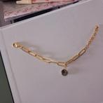 Goudkleurige armband met geboorte steen van het merk biba, Ophalen, Staal, Nieuw, Met bedels of kralen