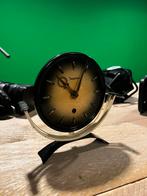 Junghans mid-century tafelklok, Ophalen