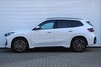BMW X1 sDrive20i High Executive M Sport Automaat / Trekhaak, Auto's, 1525 kg, Zwart, 156 pk, Wit