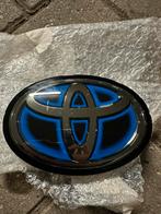 Origineel Toyota embleem – Corolla Cross radar (90975‑02160), Auto-onderdelen, Voor, Nieuw, Ophalen of Verzenden, Toyota