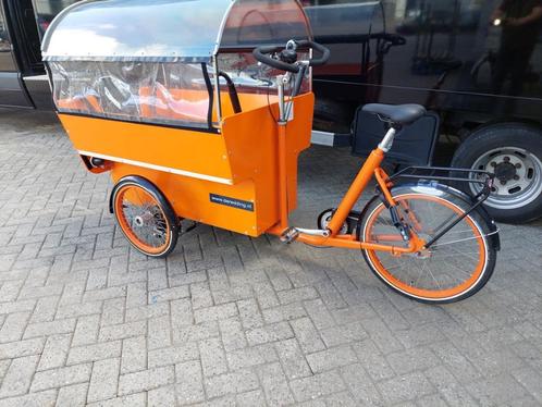 De Redding KDV bakfiets oranje Z.G.A.N.!!, Fietsen en Brommers, Fietsen | Bakfietsen, Zo goed als nieuw, Overige merken, 4 kinderen of meer