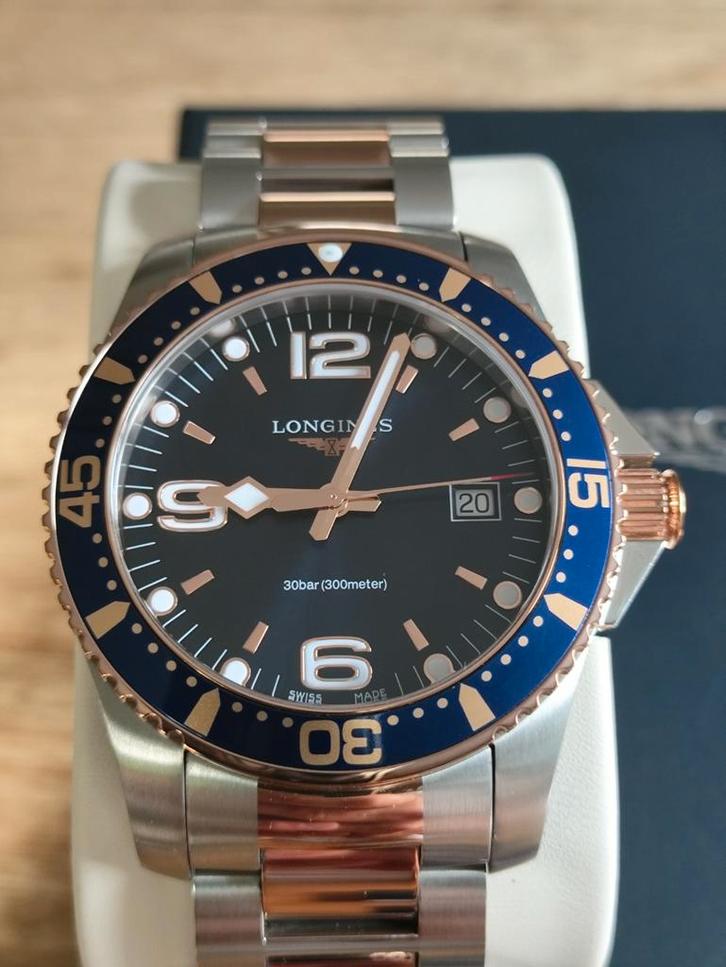 T.K. z.g.a.n. Longines HydroConquest two tone (Blauw) 2023., Sieraden, Tassen en Uiterlijk, Horloges | Heren, Zo goed als nieuw