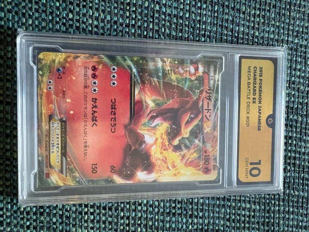 Charizard ex battle deck grade 10, Ophalen of Verzenden, Zo goed als nieuw, Meerdere kaarten, Foil