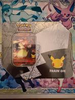 Lance Charizard Celebrations Tin USA, Ophalen of Verzenden, Zo goed als nieuw