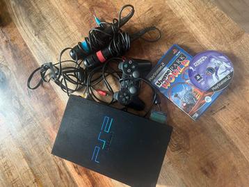 Playstation 2 met spellen en signstar microfoons beschikbaar voor biedingen