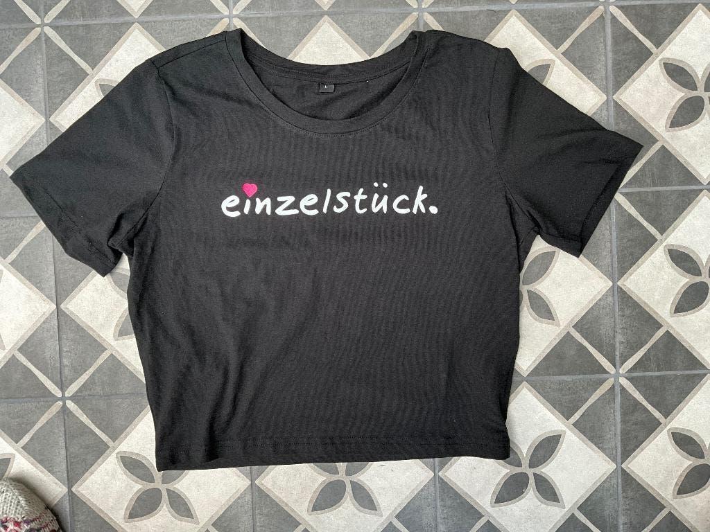 "Einzelstück." T-shirt zwart van Slogans Maat L, Kleding | Dames, Tops, "Einzelstück." T-shirt zwart van Slogans Maat L, Zwart