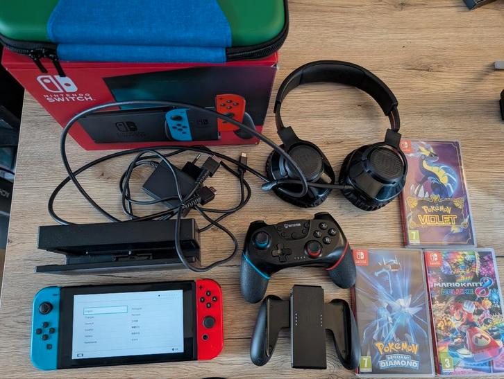Nintendo Switch 1 inclusief accesoires en spellen, Spelcomputers en Games, Spelcomputers | Nintendo Switch, Zo goed als nieuw