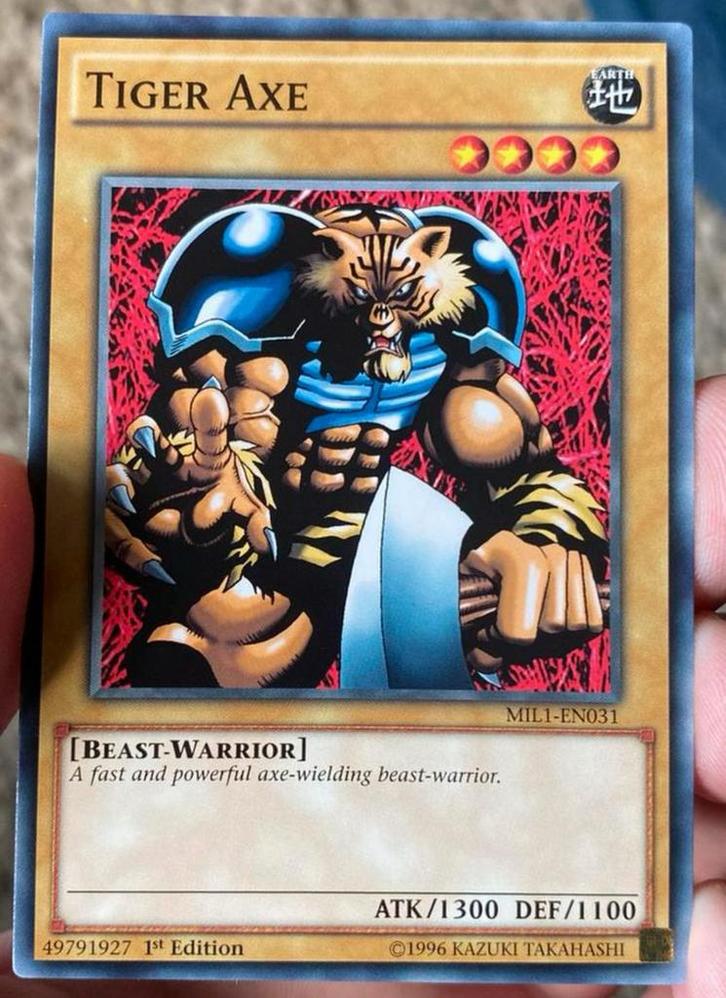 Yu-Gi-Oh! Tiger Axe MIL1 1st Edition !, Hobby en Vrije tijd, Verzamelkaartspellen | Yu-gi-Oh!, Zo goed als nieuw, Losse kaart