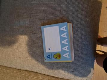 Een uitwisbaar boekje om letters en woorden en zinnen  beschikbaar voor biedingen