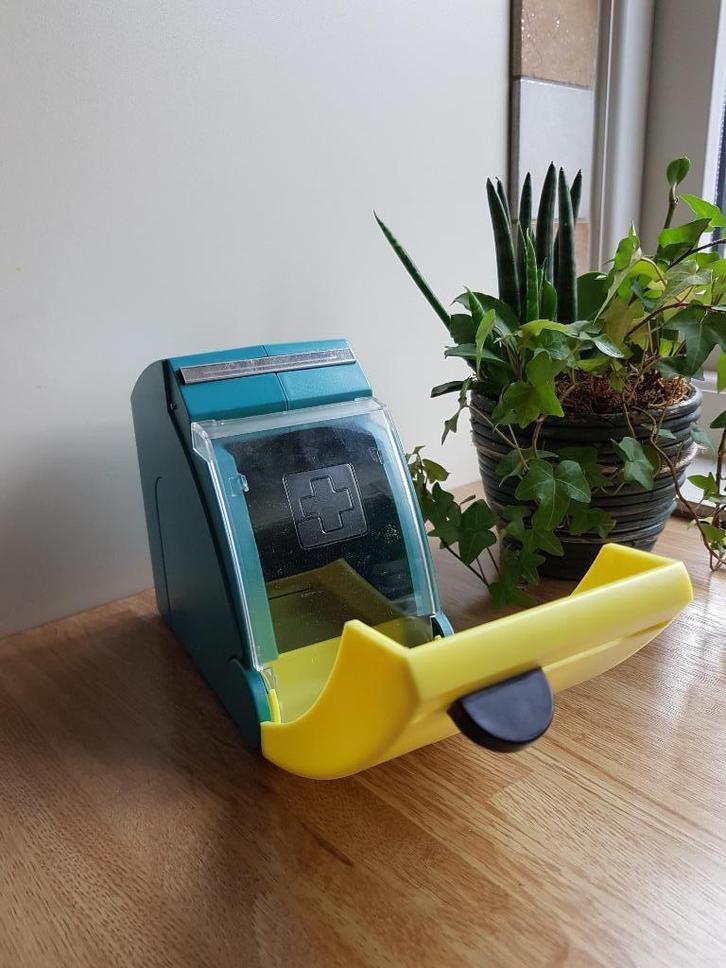 Snogg schuimverband/pleister dispenser, Diversen, Verpleegmiddelen, Zo goed als nieuw, Ophalen of Verzenden