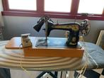 Antieke elektrische naaimachine Singer, Ophalen