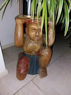 Handgesneden houten beeld, Ophalen