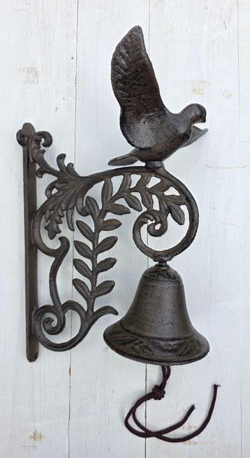 DEURBEL / VOGEL MET UITSLAANDE VLEUGELS / gietijzer beschikbaar voor biedingen
