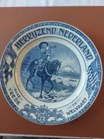 Delftsblauw bord - Herrijzend Nederland, Antiek en Kunst, Antiek | Wandborden en Tegels, Ophalen of Verzenden