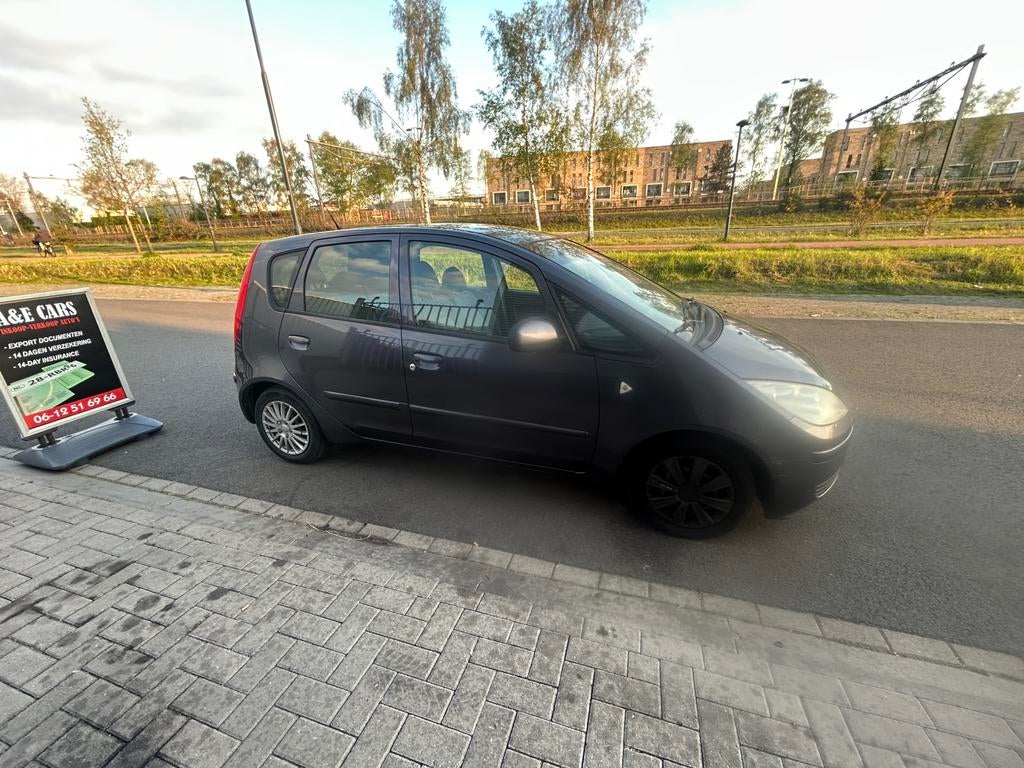 Mitsubishi Colt 1.3 CZ5 2006 Grijs, Auto's, Mitsubishi, 31 €/maand, Origineel Nederlands, Bedrijf, Handgeschakeld