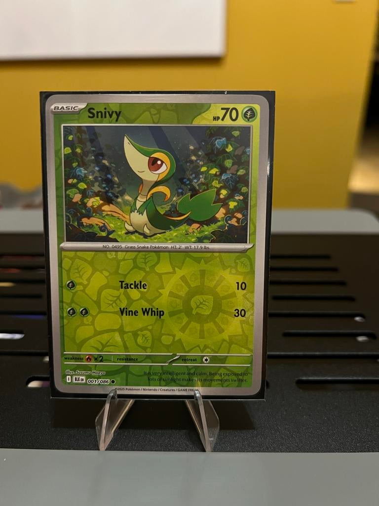 Pokémon Kaart Snivy Reverse holo 001/086 Basic HP70, Ophalen of Verzenden, Zo goed als nieuw, Losse kaart