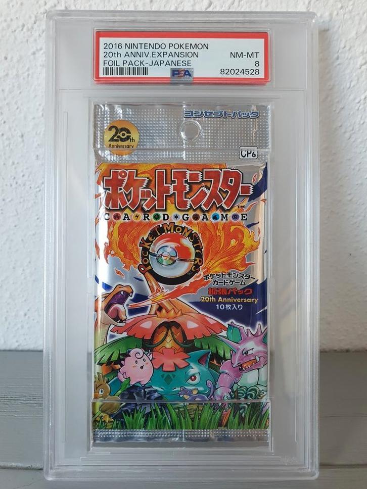 20th Anniversary Foil Boosterpack Sealed PSA 8 2016 Expansio, Hobby en Vrije tijd, Verzamelkaartspellen | Pokémon, Nieuw, Booster