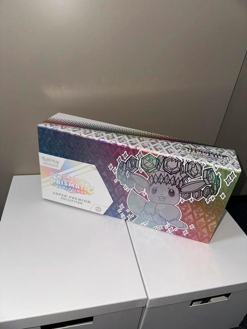 Prismatic Evolutions - Super Premium Collection, Hobby en Vrije tijd, Verzamelkaartspellen | Pokémon, Zo goed als nieuw, Ophalen of Verzenden