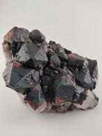 Iriserende hematiet op bergkristal