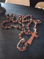 Houten rozen krans, Ophalen