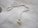 32.  Ketting met haaientand, Ophalen