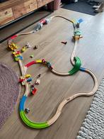 Houten treinbaan Hape en bouw terrein, Kinderen en Baby's, Speelgoed | Houten speelgoed, Overige typen, Ophalen of Verzenden, Zo goed als nieuw