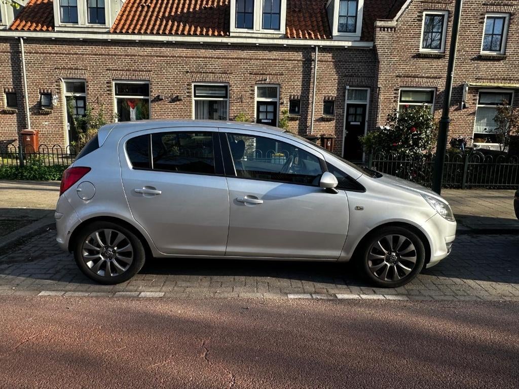 Opel Corsa 1.4 16V 5D 2010 Grijs, Auto's, Voorwielaandrijving, 1063 kg, 4 cilinders, Airbags