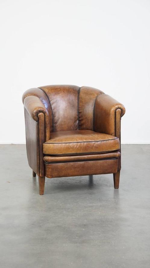 Vintage schapenleren clubfauteuil met zwarte biezen, Huis en Inrichting, Fauteuils, Gebruikt, Leer, 50 tot 75 cm, 75 tot 100 cm