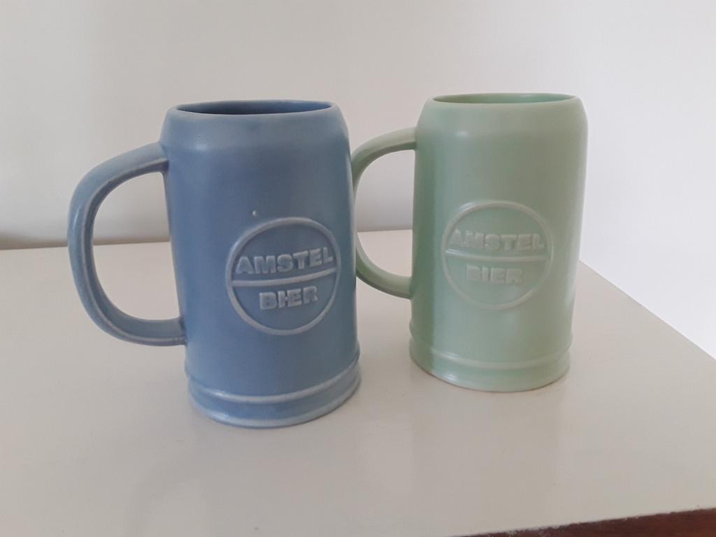 Set aardewerken bierpullen Amstel bier, blauw en groen, Ophalen of Verzenden, Zo goed als nieuw, Overige stijlen, Glas of Glazen