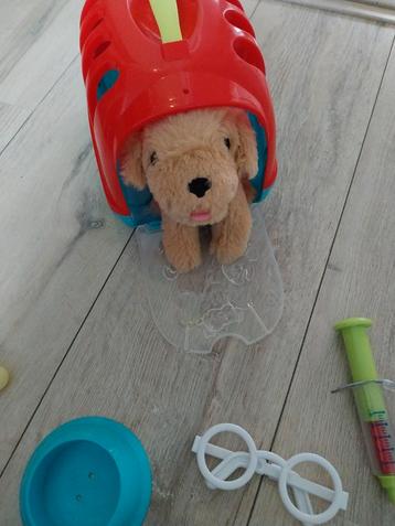 Puppy met bench en dierenarts spullen beschikbaar voor biedingen