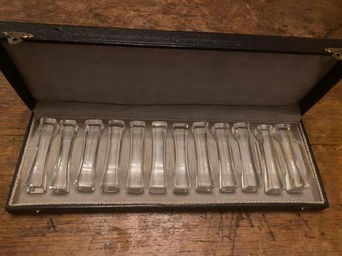 Mooie set van 12 kristallen messenleggers in cassette, Antiek en Kunst, Antiek | Bestek, Ophalen of Verzenden